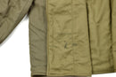 Close-up of genuine Czech army M60 quilted liner jacket interior showing quilted cotton fabric and stamped markings