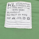Close-up of Dutch army parka liner care label showing fabric composition and washing instructions on olive green fabric