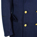 Close-up of genuine Italian army blue wool overcoat with gold military buttons and side pocket detail.