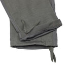 Close-up of gray Leo Kohler work pants with Cordura reinforced hems and adjustable leg ties for durability and fit