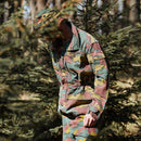 Person wearing original Belgian Army M90 camo field jacket parka and matching cap in a forest setting