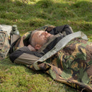 Man resting outdoors in original Dutch military DPM camouflage Goretex bivy sack sleeping bag