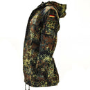 Original German army field jacket parka in flecktarn camo with hood and German flag patch on sleeve side view