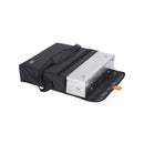 Fold-away compact ESBIT BBQ charcoal grill partially inside its black waterproof carrying bag with adjustable shoulder strap