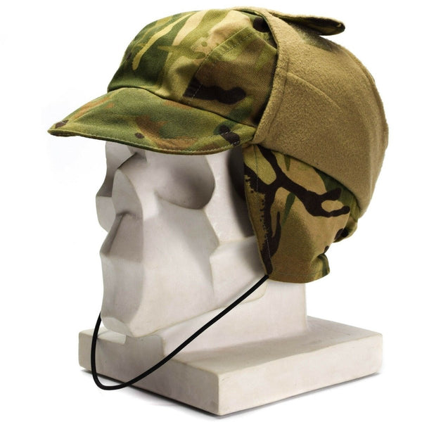 British Army MTP camouflage waterproof Gore-Tex paratrooper cap with lined cold weather ear flaps on display mannequin head