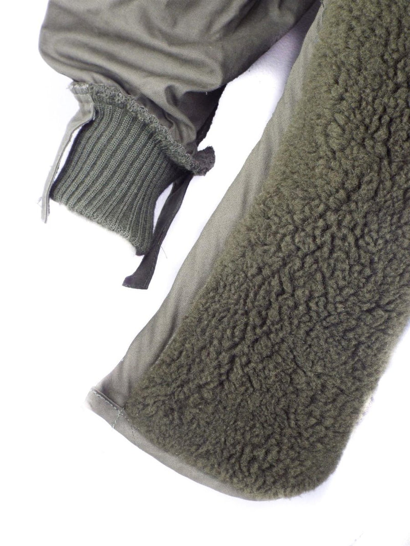 Close-up of genuine Dutch army olive green parka liner showing wool interior and ribbed cuff detail