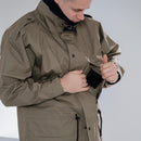 Man wearing genuine Dutch army parka in khaki green showing inner liner and front pockets design