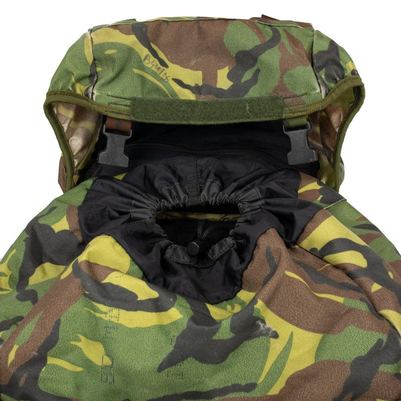 Close-up of genuine Dutch Army DPM woodland camouflage rucksack top with drawstring closure and flap lid.