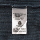 Clothing care label showing 50% virgin wool 50% polyacryl content and washing instructions for Dutch military sweater