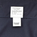 Close-up of fabric label showing 67% polyester 33% cotton content on navy blue military police jacket