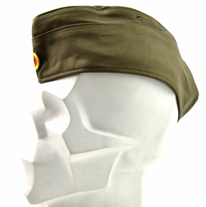 Genuine German army olive green side cap with adjustable strap and classic garrison design on white mannequin head