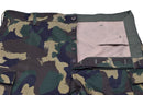 Close-up of genuine Hungarian M1990 military field pants in woodland camo with button fly and reinforced fabric.