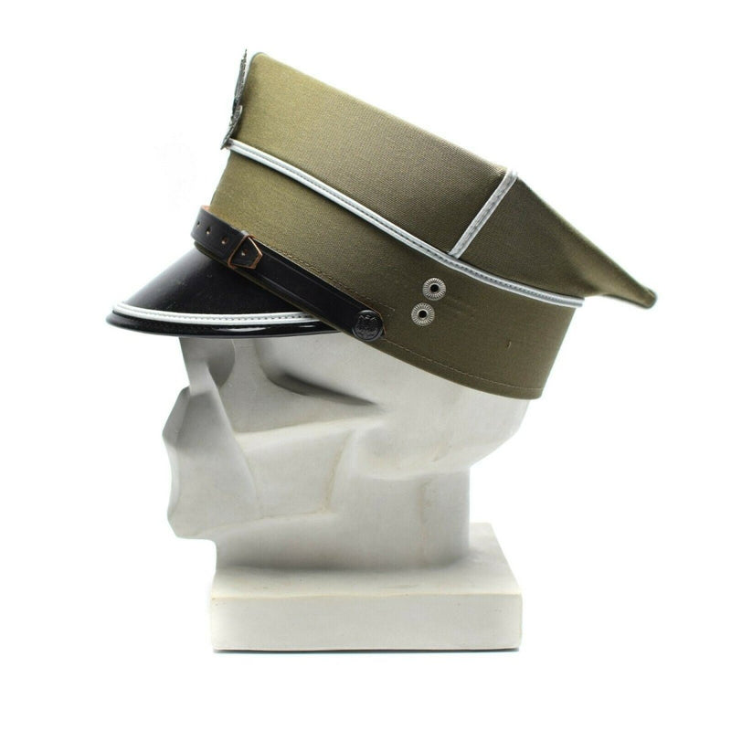 Genuine Polish military officer peaked cap with eagle cockade, olive wool fabric and black visor on a white mannequin head.
