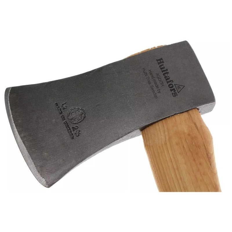Close-up of HULTAFORS felling axe with durable carbon steel head and hickory wood handle angled on white background