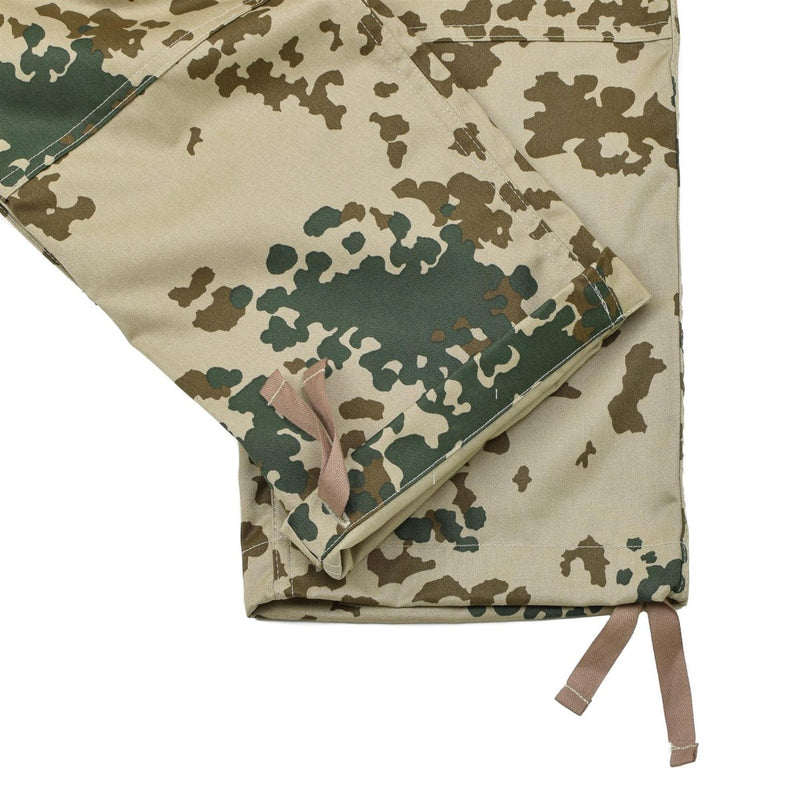 Close-up of Leo Kohler Commando tactical field pants in Tropentarn camo with adjustable ankle straps and reinforced stitching