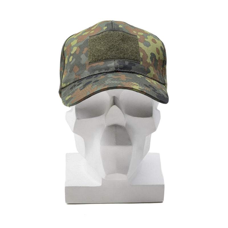 Leo Kohler military flecktarn camouflage baseball cap with adjustable strap and peaked visor on white mannequin head.