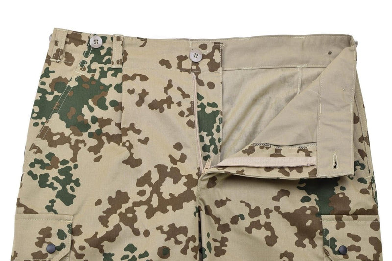 Close-up of Leo Kohler military tactical field pants in Tropentarn desert camouflage with button and zipper details.