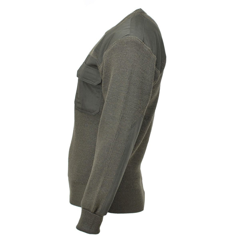 Green sweater with pocket details on a white background