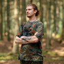 Man wearing MFH U.S. military-style BW camouflage lightweight breathable sportswear t-shirt in forest setting