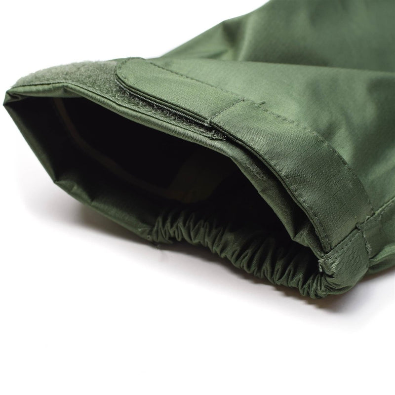 Close-up of olive green Mil-Tec waterproof men's jacket sleeve with adjustable Velcro cuff and elastic wrist band.