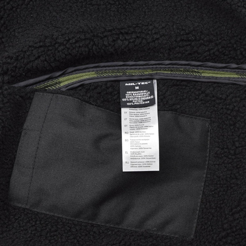 Close-up of MIL-TEC German Military Lumberjack jacket interior showing fabric and care label details