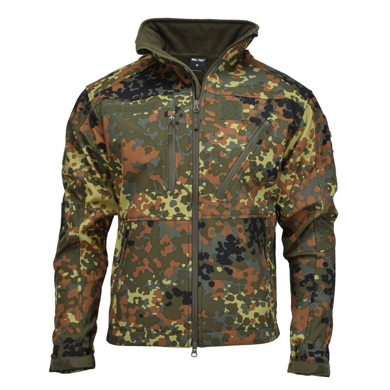 MIL-TEC softshell jacket in German Flecktarn camo with zippered pockets, reinforced elbows, and adjustable cuffs for outdoor use.