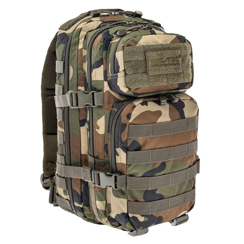 MIL-TEC U.S. Assault tactical backpack 20 liters in woodland camouflage with MOLLE system and padded straps for hiking and trekking