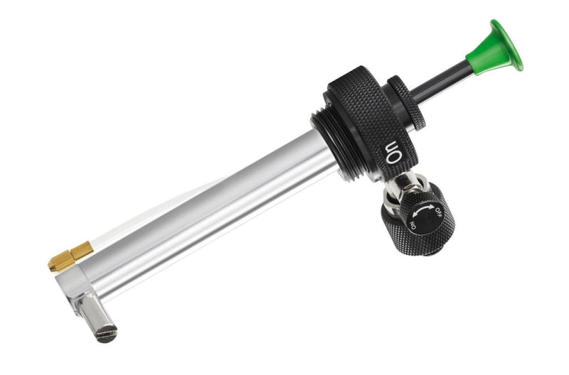 Aluminum Optimus Polaris fuel pump with quick-connect fittings and fuel flow control for outdoor stove use.