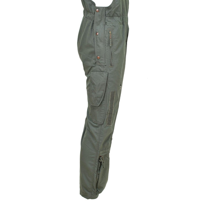 Original Czech Army flame-resistant aramid cargo bib pants in olive green with multiple pockets and reinforced stitching.