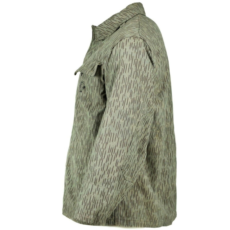 Side view of original Czech army M60 field jacket in raindrop camouflage with buttoned chest pocket and rugged fabric.