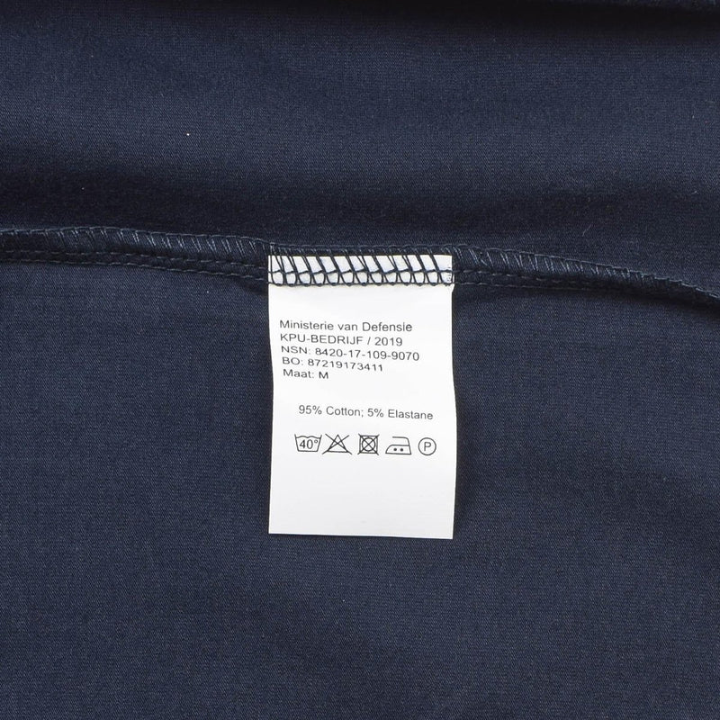 Close-up of a navy blue Dutch army t-shirt cotton fabric showing care label and stitching detail