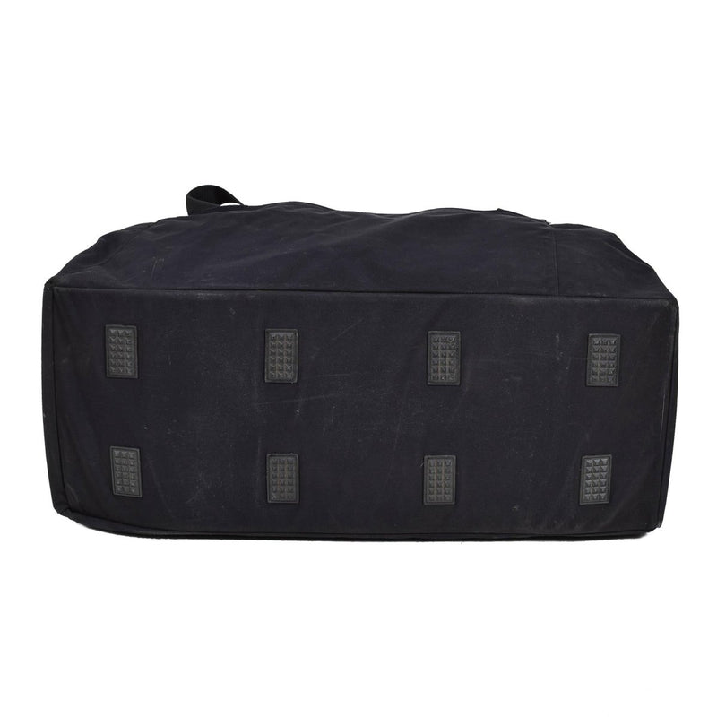 Bottom view of black Original Dutch Military duffle bag showing reinforced base with protective rubber feet for durability.