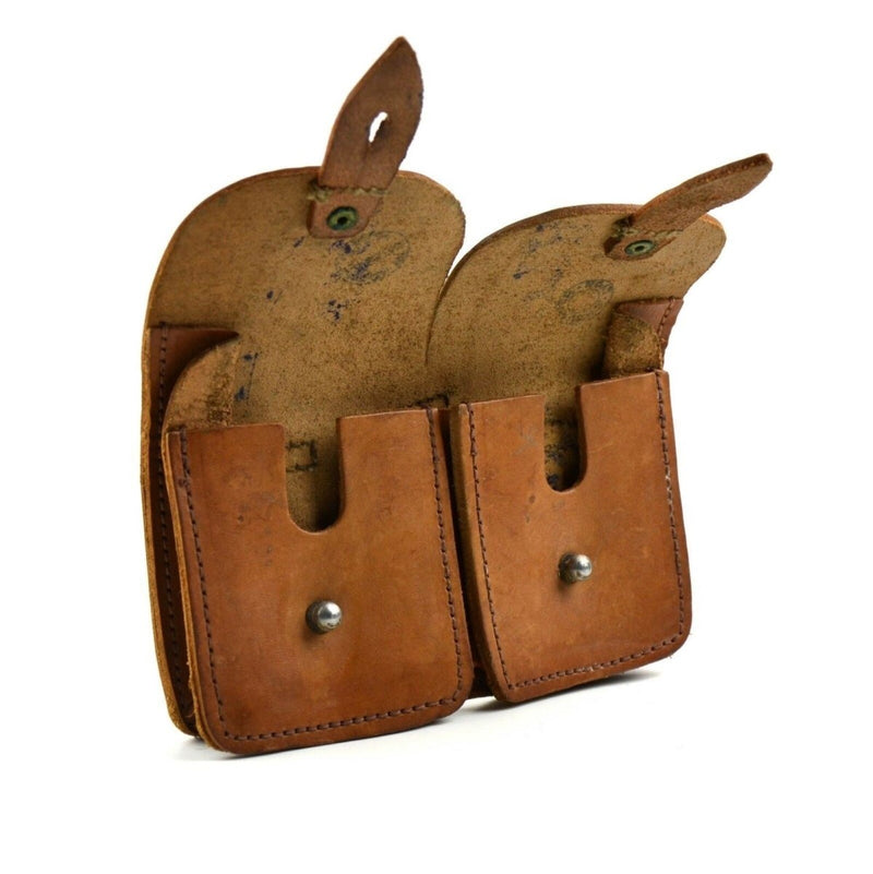 Vintage French army double magazine pouch made of brown leather with flap closures and metal buttons.