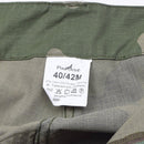 Close-up of size and care label inside French military CCE camo cargo pants with anti-mosquito treatment details