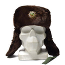 Original German police faux fur ushanka winter hat with ear flaps and badge for cold weather warmth.