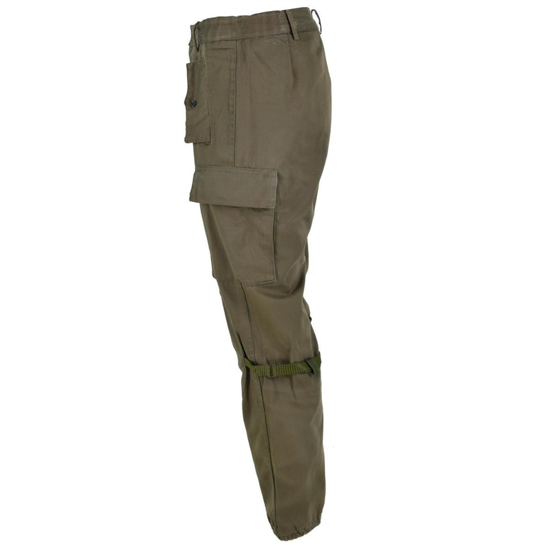 Original Italian army combat trousers in olive drab with cargo pockets, reinforced knees, and elasticated bottoms.