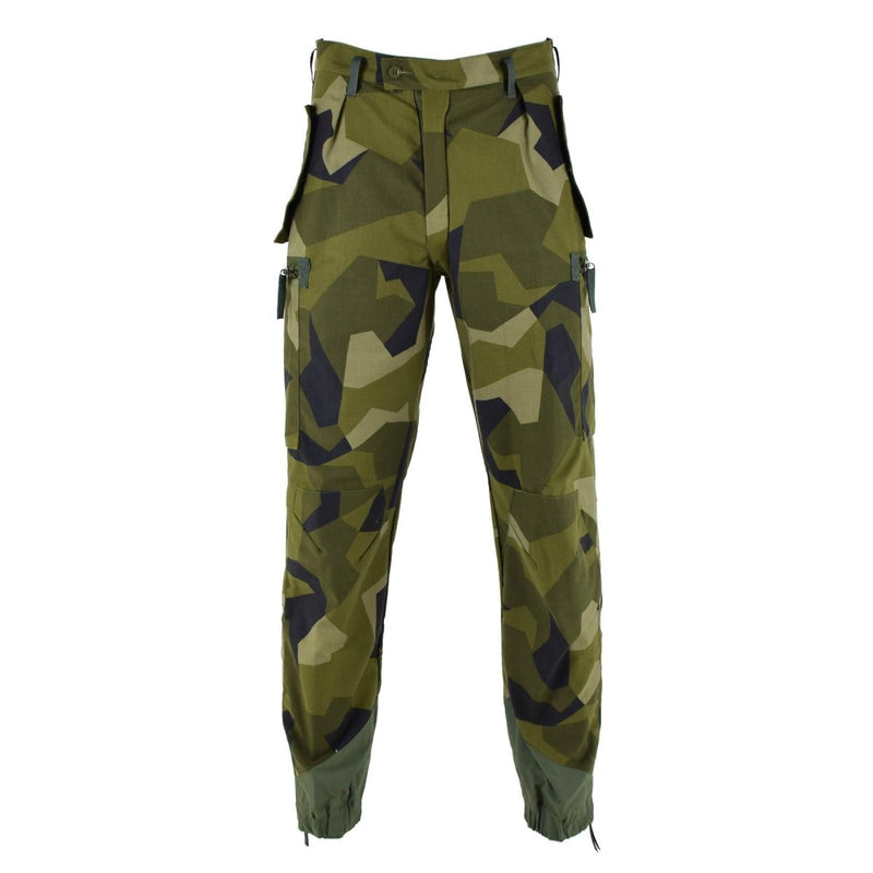Original Swedish military M90 camouflage pants with reinforced knees, secure pockets, and wide belt loops for outdoor and tactical use.