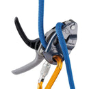 Close-up of a Petzl GRIGRI+ assisted braking belay device with blue climbing rope and orange carabiner.