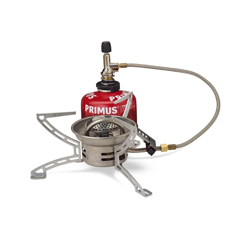 Compact Primus EasyFuel Duo foldable propane and butane camping stove with remote canister and foldable legs for outdoor cooking.