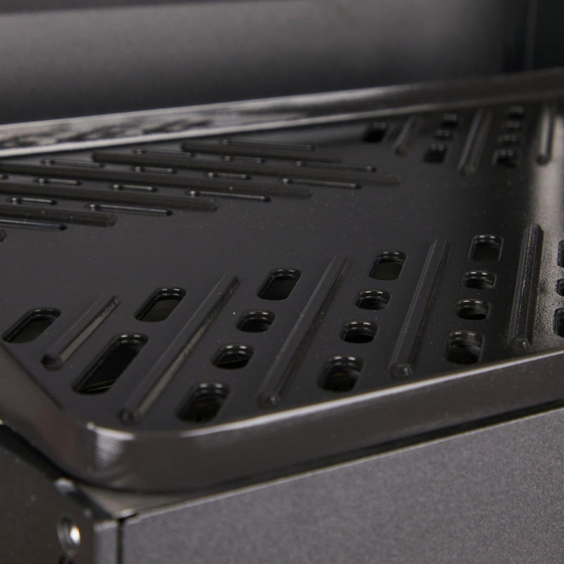 Close-up of the black non-stick metal grill surface of the Primus Kuchoma portable camping BBQ stove.