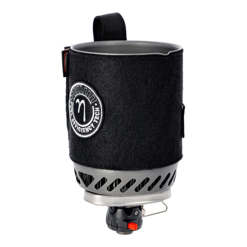 Compact Primus Lite Stove System with insulated pot cover, push-button ignition, and efficient burner for backpacking cooking.