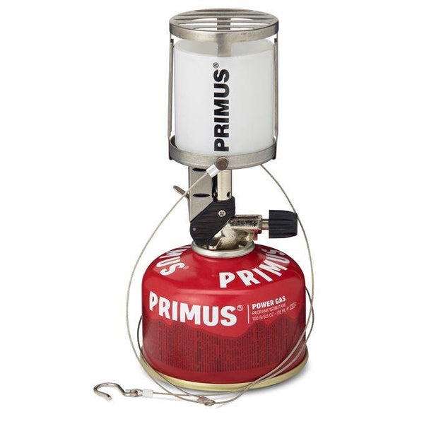 Primus Micron portable camping lantern with red gas canister, compact and adjustable brightness for hiking and backpacking.