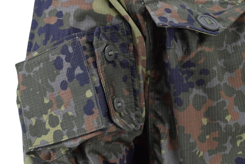 Close-up of TACGEAR Flecktarn camo German military style field jacket sleeve with buttoned pocket and ripstop fabric texture.