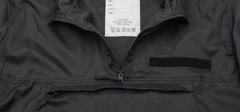 Close-up of TACGEAR black windproof lightweight camping hiking smock with YKK zipper and ripstop nylon fabric detail