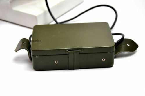 Green rectangular box with a strap on a white background